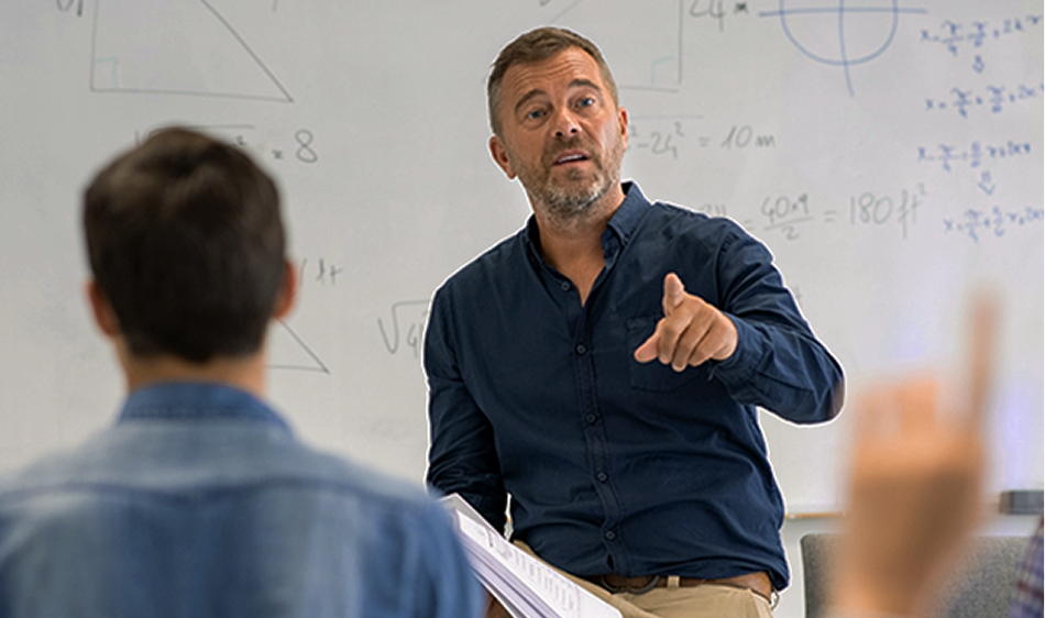 A teacher speaking with students