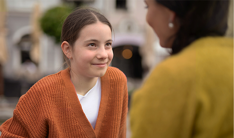 A student speaking with an educator